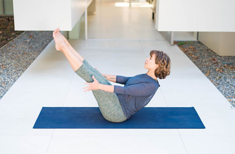 7 Invigorating Yoga Poses to Sweat Your Asana Off Hero Image