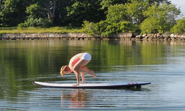 5 Reasons To Take Your Yoga Practice Off The Mat & Onto A Paddleboard Hero Image