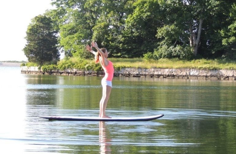 5 Reasons To Take Your Yoga Practice Off The Mat & Onto A Paddleboard Hero Image