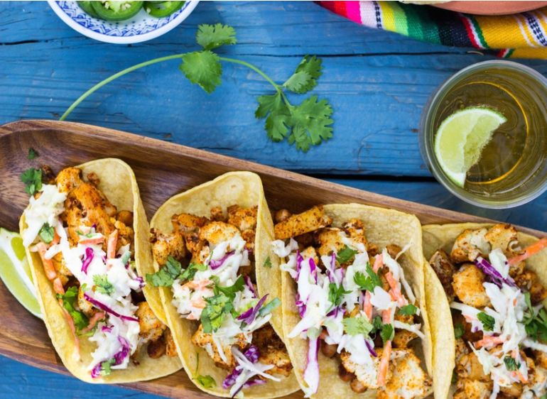 11 Tasty + Plant-Based Ways To Celebrate National Taco Day Hero Image
