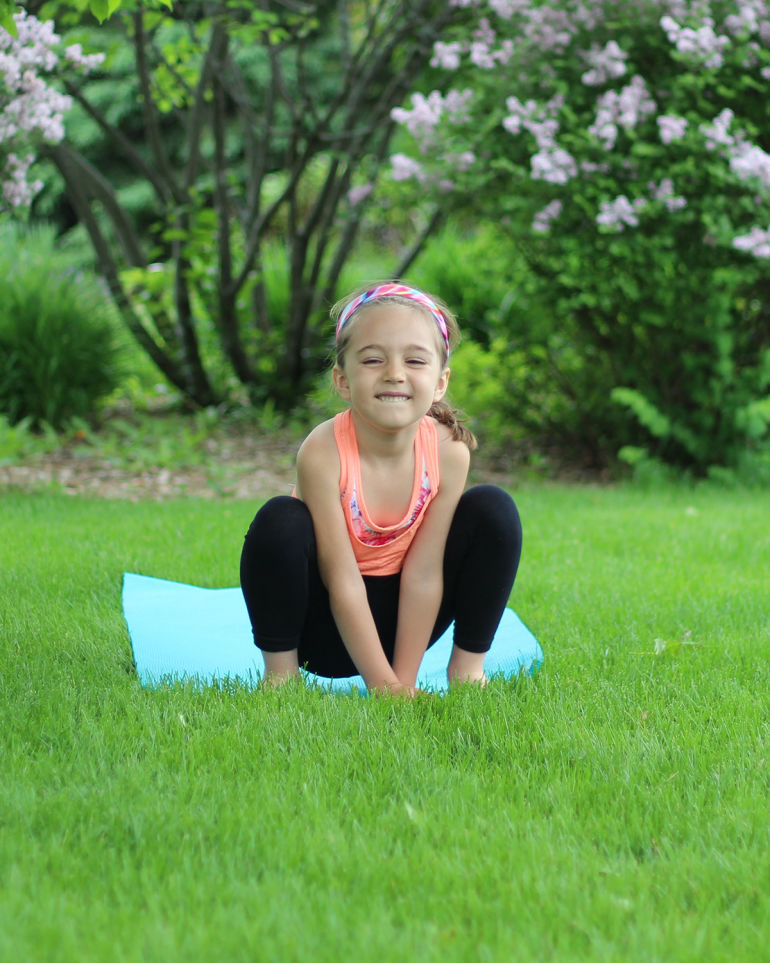 A 5-Minute Energizing Yoga Sequence You Can Do With Your Kid Hero Image