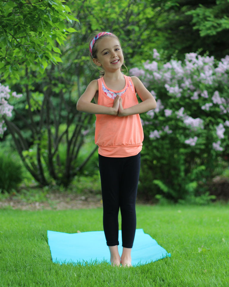 A 5-Minute Energizing Yoga Sequence You Can Do With Your Kid Hero Image
