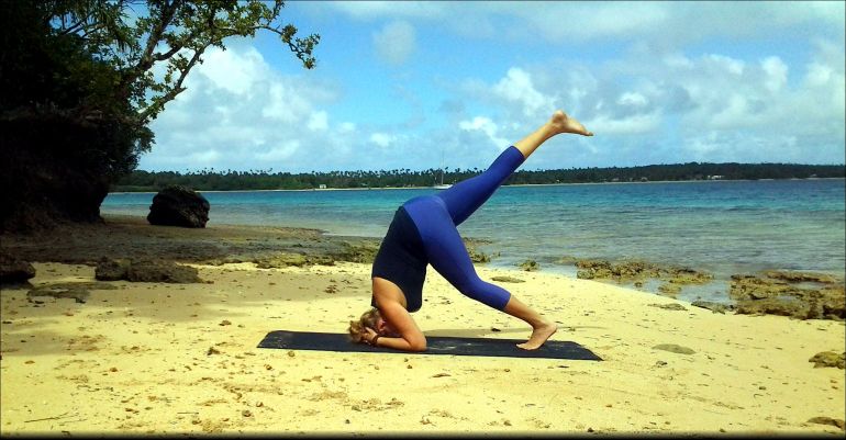 A Step-By-Step Guide To Nailing A Headstand Without Hurting Yourself Hero Image