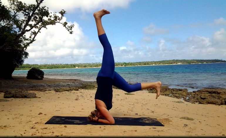 A Step-By-Step Guide To Nailing A Headstand Without Hurting Yourself Hero Image