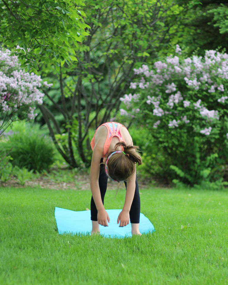 A 5-Minute Energizing Yoga Sequence You Can Do With Your Kid Hero Image