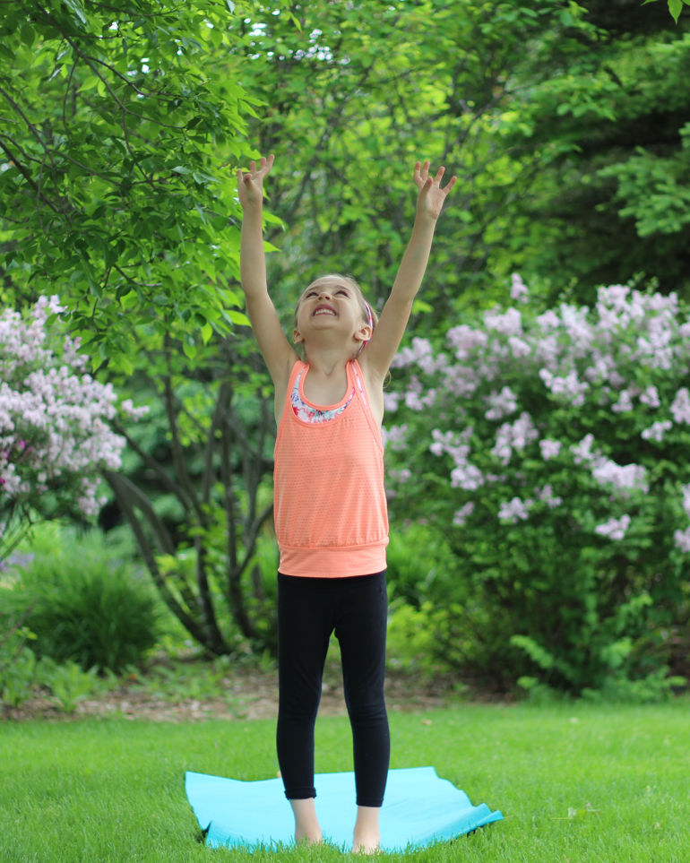 A 5-Minute Energizing Yoga Sequence You Can Do With Your Kid Hero Image