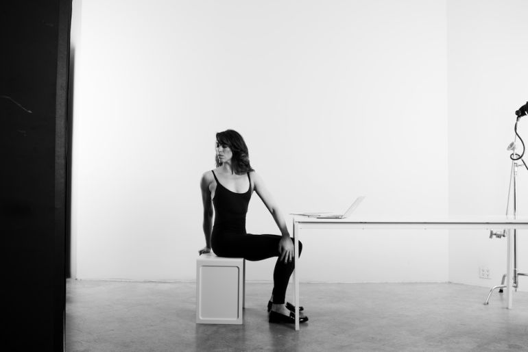 4 Easy Yoga Poses To Practice At Your Desk Hero Image