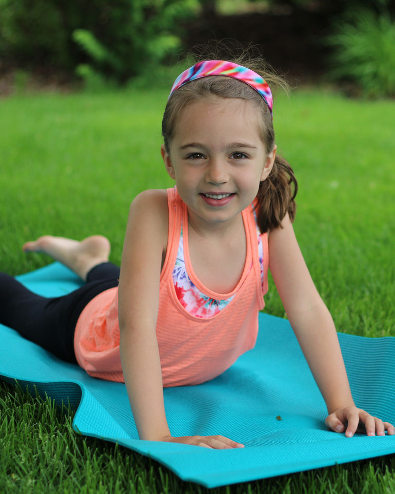 A 5-Minute Energizing Yoga Sequence You Can Do With Your Kid Hero Image