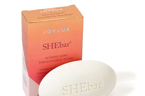 white bar of soap in front of orange box