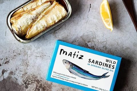 Matiz sardine can on marble table with leom