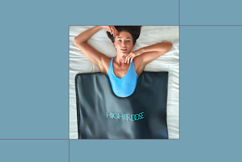 HigherDose infrared sauna blanket on blue background HigherDose infrared sauna blanket on blue background