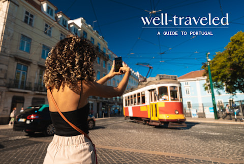 Woman taking a photo in Lisbon, Portugal Woman taking a photo in Lisbon, Portugal
