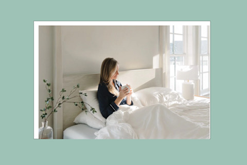 Best Cooling Comforter Women Sitting on Bed Drinking coffee with Comforter