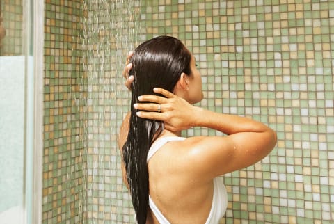 woman in shower washing hair