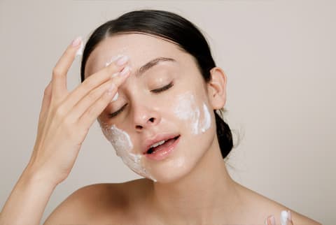 woman washing face