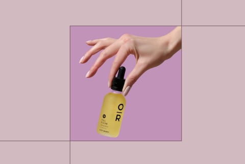 The Best CBD Oils Onxy + Rose Held By Hand