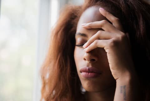 woman looking stressed and upset