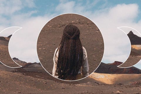 back of woman walking in dirt with celestial overlay