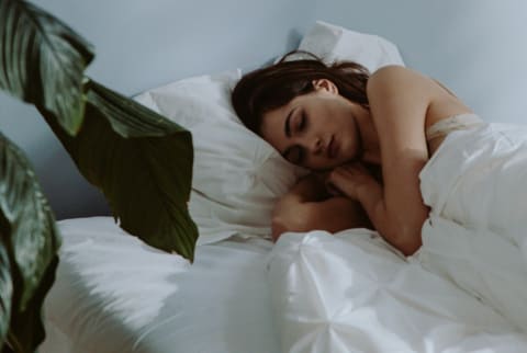 beautiful woman sleeping on bed