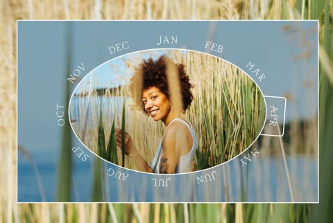 April Monthly Horoscope frame featuring woman with textured hair in reeds by water