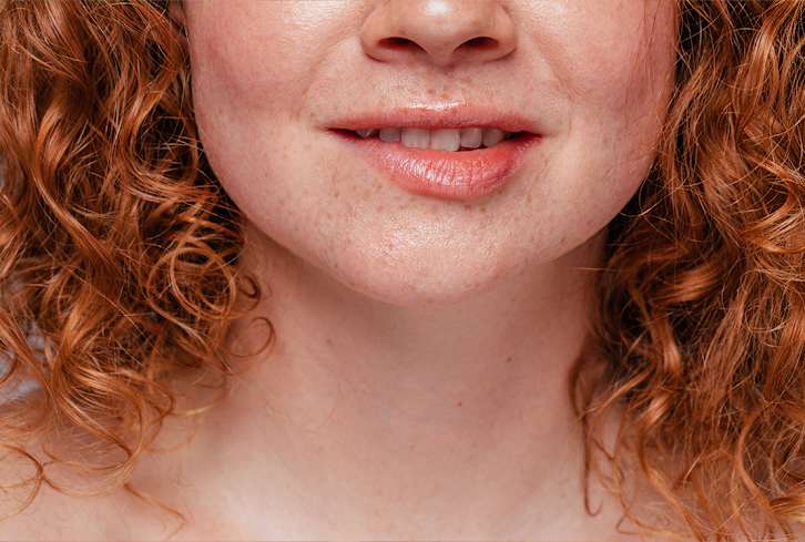 How Alcohol Impacts Your Oral Microbiome, According To A Dentist
