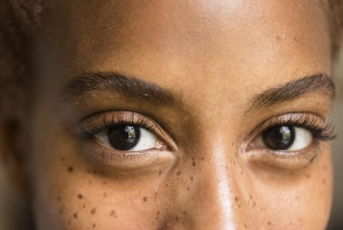 woman up close with long eyelashes