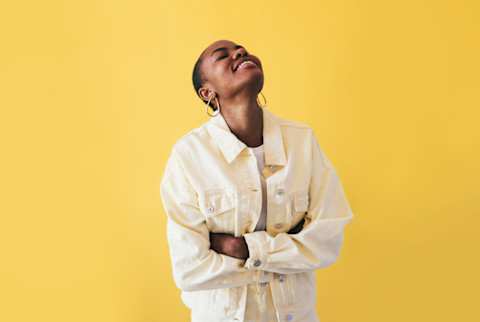 Smiling woman on a yellow background Smiling woman on a yellow background