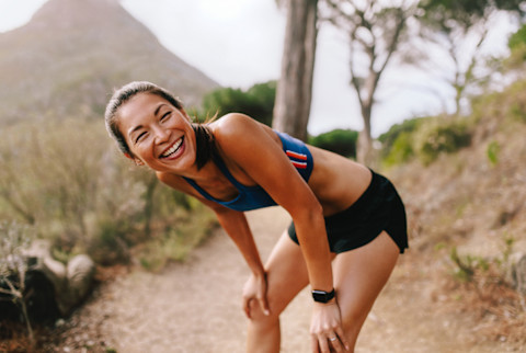 Woman Running Outdoors, Catching Her Breath Woman Running Outdoors, Catching Her Breath