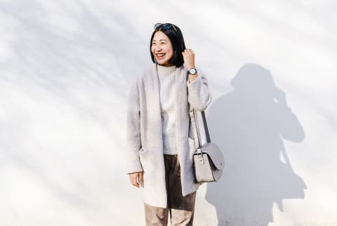 Woman Smiling in Dappled Light On a Spring Day