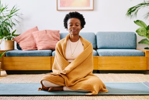 Woman Meditating at Home