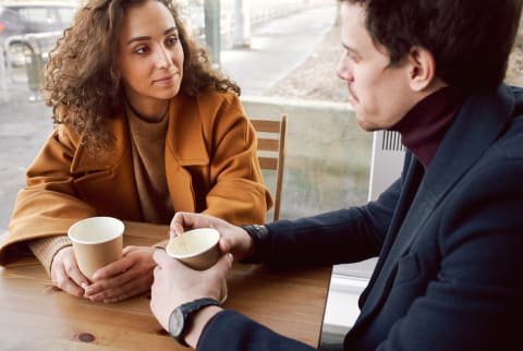 Man and Woman Talking in a Cafe