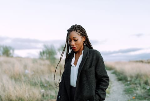 Woman Waking Outdoors At Twilight