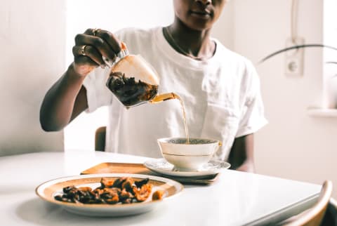 Woman Pouring Tea