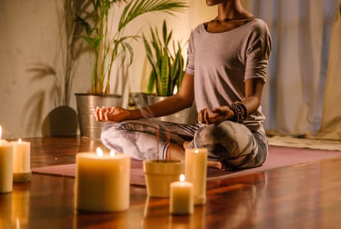 Woman Peacefully Meditating On A Summer Evening