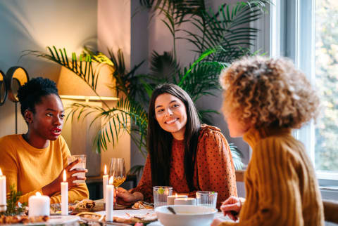 Friends Gathered around a Table In the Late Afternoon