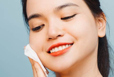 Young Woman Applying Facial Toner