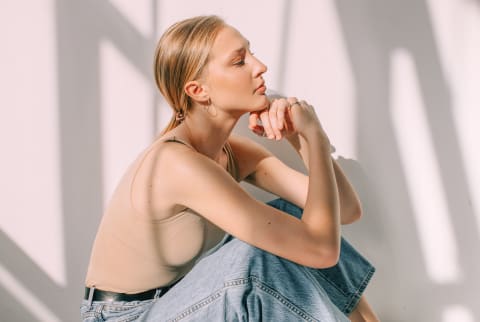 Stressed Woman Sitting in Sunlight