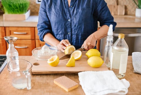 Woman Making Her Own Natural Cleaning Products At Home