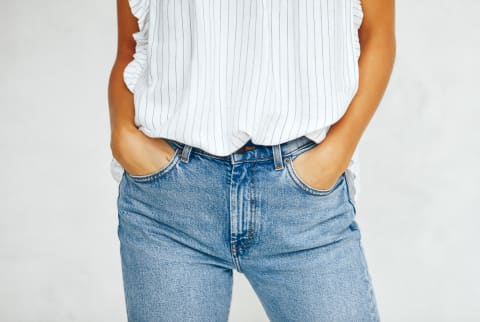 Young Woman With Her Hands In Her Jeans Pockets