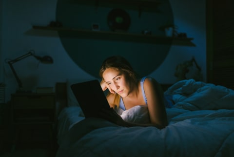 Young Woman Staying Up Late on Her Computer