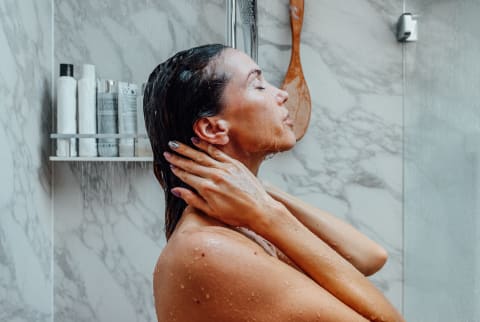 Woman Enjoying Fresh Water In Shower