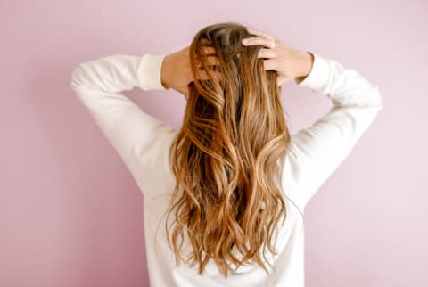 Woman Running Fingers Through Her Hair