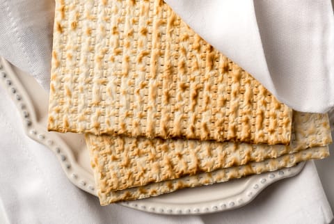 Jewish Passover matzah wrapped in napkin on table ready for Passover Sedar