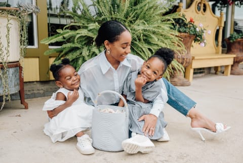 mother with two daughters laughing and smiling 