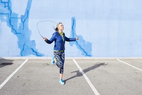 Aged Fitness Woman Using Skipping Rope.