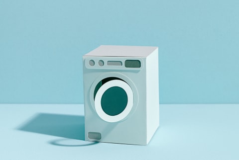 Paper Model of a Washing Machine on a Minimal Blue Background