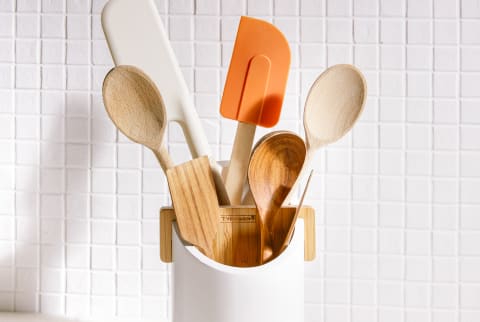 Silicone Spatulas and Wooden Spoons in a Crock on a Kitchen Counter