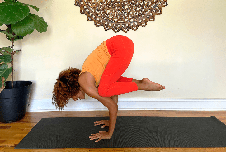 How To (Finally) Nail One Of Yoga's Most Popular Arm Balances: Crow Pose