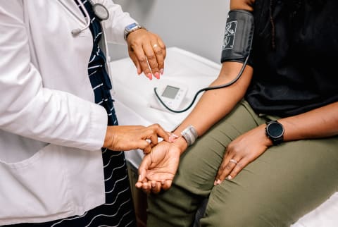 Doctor Checking Patient's Blood Pressure