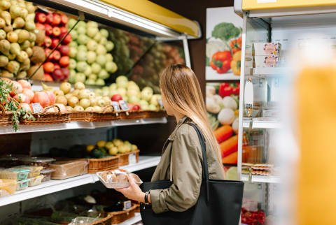 Woman Making Purchase In An Ecological Store